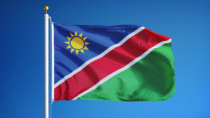 Obraz premium Namibia flag waving against clean blue sky, close up, isolated with clipping path mask alpha channel transparency