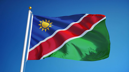 Namibia flag waving against clean blue sky, close up, isolated with clipping path mask alpha channel transparency