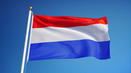 Holland flag waving against clean blue sky, close up, isolated with clipping path mask alpha...