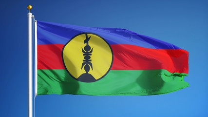 New Caledonia flag waving against clean blue sky close up, isolated with clipping path mask alpha channel transparency