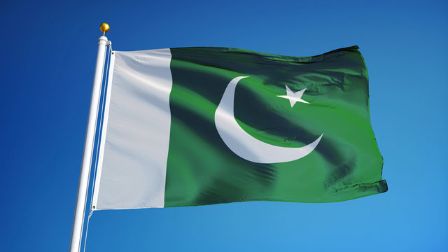 Pakistan flag waving against clean blue sky, close up, isolated with clipping path mask alpha channel transparency