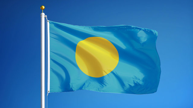 Palau flag waving against clean blue sky, close up, isolated with clipping path mask alpha channel transparency