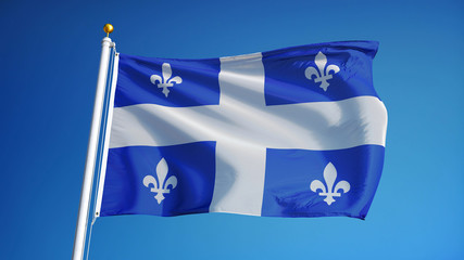 Quebec flag waving against clean blue sky, close up, isolated with clipping path mask alpha channel transparency
