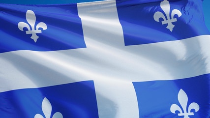 Quebec flag waving against clean blue sky, close up, isolated with clipping path mask alpha channel...