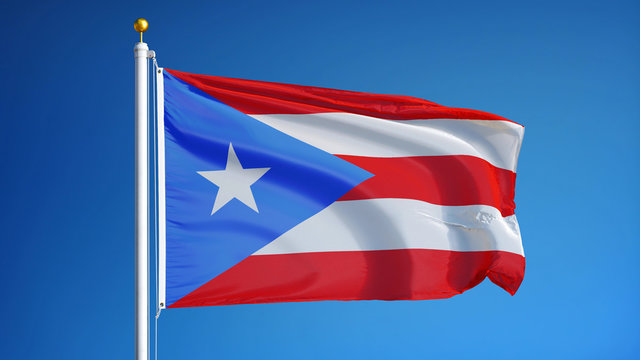 Puerto Rico flag waving against clean blue sky, close up, isolated with clipping path mask alpha channel transparency