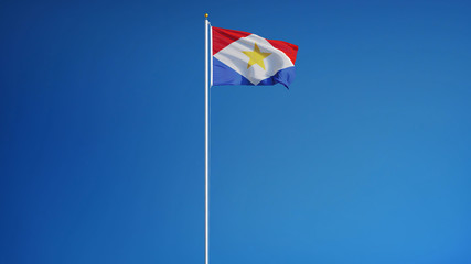 Naklejka premium Saba flag waving against clean blue sky, long shot, isolated with clipping path mask alpha channel transparency
