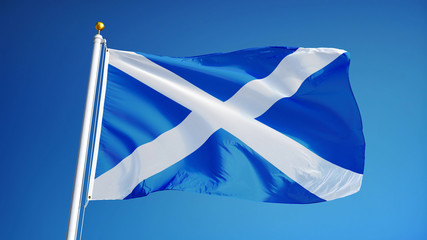 Scotland flag waving against clean blue sky, close up, isolated with clipping path mask alpha...