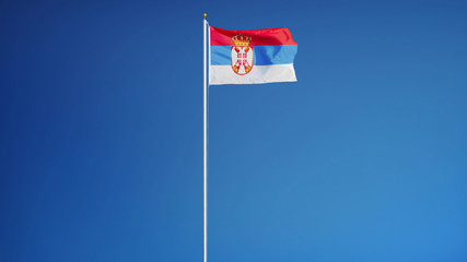 Serbia flag waving against clean blue sky, long shot, isolated with clipping path mask alpha channel transparency