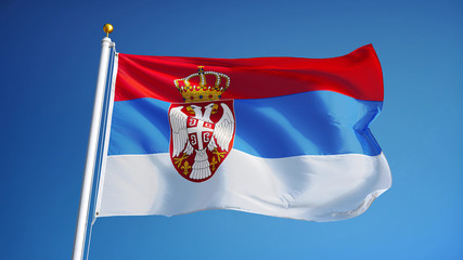 Serbia flag waving against clean blue sky, close up, isolated with clipping path mask alpha channel transparency
