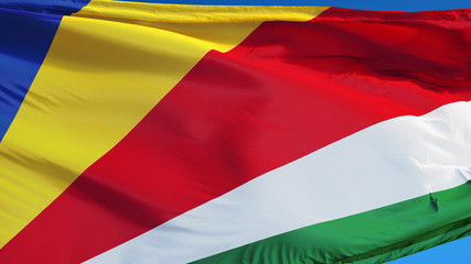 Seychelles flag waving against clean blue sky, close up, isolated with clipping path mask alpha channel transparency