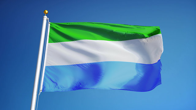 Sierra Leone flag waving against clean blue sky, close up, isolated with clipping path mask alpha channel transparency