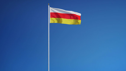 South Ossetia flag waving against clean blue sky, long shot, isolated with clipping path mask alpha channel transparency