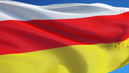 South Ossetia flag waving against clean blue sky, close up, isolated with clipping path mask alpha channel transparency