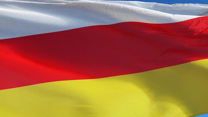 South Ossetia flag waving against clean blue sky, close up, isolated with clipping path mask alpha channel transparency