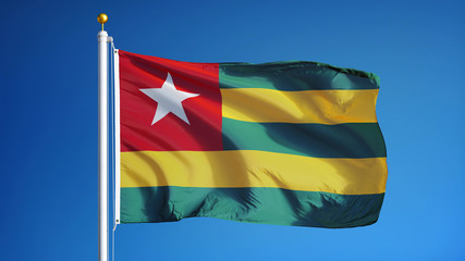 Togo flag waving against clean blue sky, close up, isolated with clipping path mask alpha channel transparency