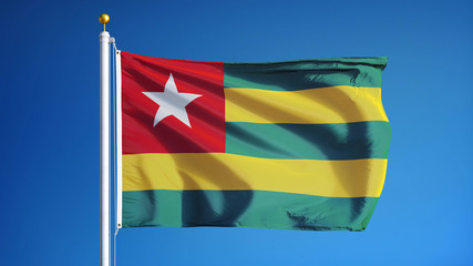 Togo flag waving against clean blue sky, close up, isolated with clipping path mask alpha channel transparency