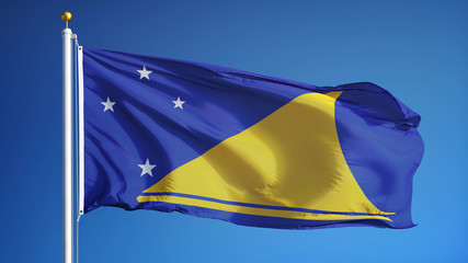 Tokelau flag waving against clean blue sky, close up, isolated with clipping path mask alpha channel transparency