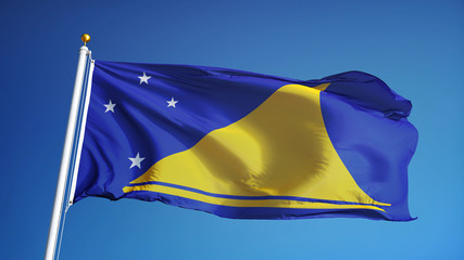 Tokelau flag waving against clean blue sky, close up, isolated with clipping path mask alpha channel transparency
