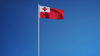 Tonga flag waving against clean blue sky, long shot, isolated with clipping path mask alpha channel transparency