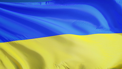 Ukraine flag waving against clean blue sky, close up, isolated with clipping path mask alpha channel transparency
