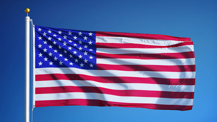 USA flag waving against clean blue sky, close up, isolated with clipping path mask alpha channel transparency