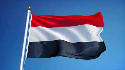 Naklejka na ściany i meble Yemen flag waving against clean blue sky, close up, isolated with clipping path mask alpha channel transparency