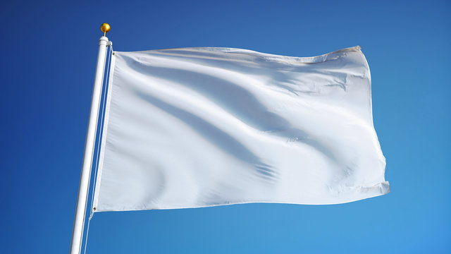 Empty white clear flag waving against clean blue sky, close up, isolated with clipping path mask alpha channel transparency