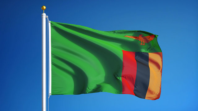 Zambia flag waving against clean blue sky, close up, isolated with clipping path mask alpha channel transparency