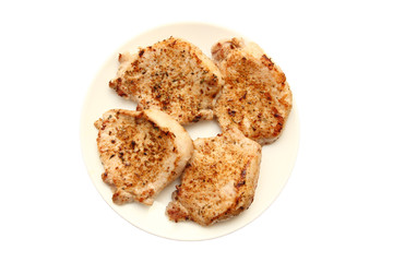four fried pork steak on a plate isolated on a white background with clipping path