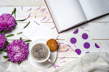 Word relax with cup of coffee and pink flowers