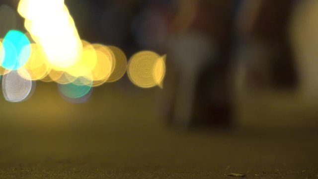 Blurred Girl In High Heels Walking From The Camera At Night. Shallow Focus 4K Video