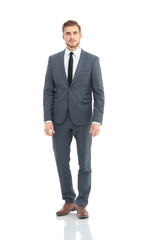 Happy business man wearing grey suit standing and folding arms