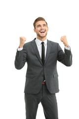Lucky handsome businessman celebrating. Winner  laughing man