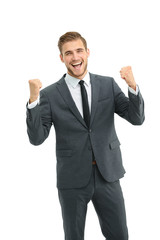 Businessman celebrating  with his fists raised in the air and a 