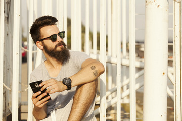 Handsome Man With Beard Using Smart Phone Outdoor
