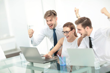 Business team celebrating a triumph with arms up