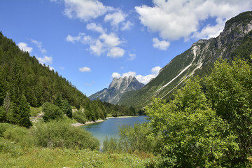 Fototapeta na wymiar Lago del Predil on a mid-summer's day in Friuli Venezia Giulia, north east Italy. 