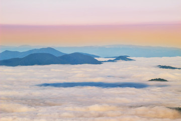 Fototapeta na wymiar Picturesque sunrise morning in mountains above clouds, Carpathians, Ukraine.