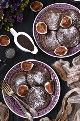 Obraz na płótnie Canvas Chocolate pancakes with chocolate sauce and figs 