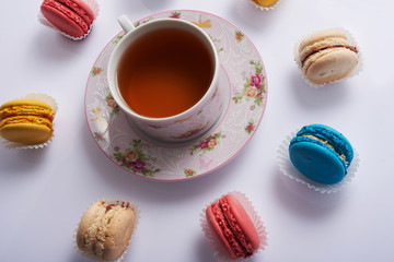 macaroon circle and tea on a white background