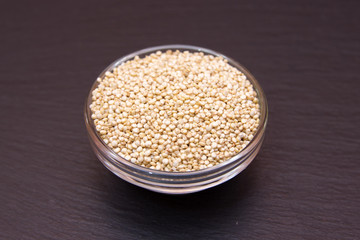 Bowl with quinoa on a slate floor