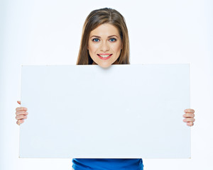 Smiling woman holding advertising board