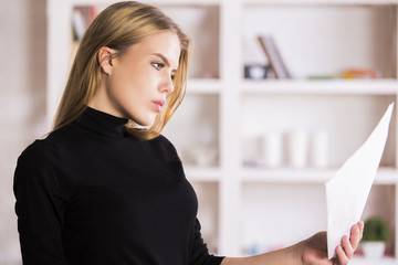 Girl doing paperwork in office