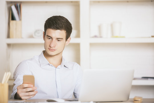 European man using cellphone