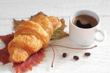 Croissant and coffee cup