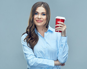 Smiling business woman holding red coffee glass.