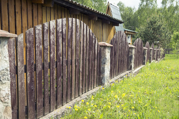 the fence of a country house