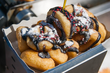 Mini donuts with chocolate, sprinkles and sugar