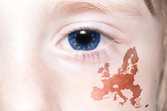 human's face with national flag and map of european union.