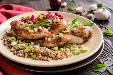 Baked chicken breast with boiled buckwheat and steamed beetroot and onion